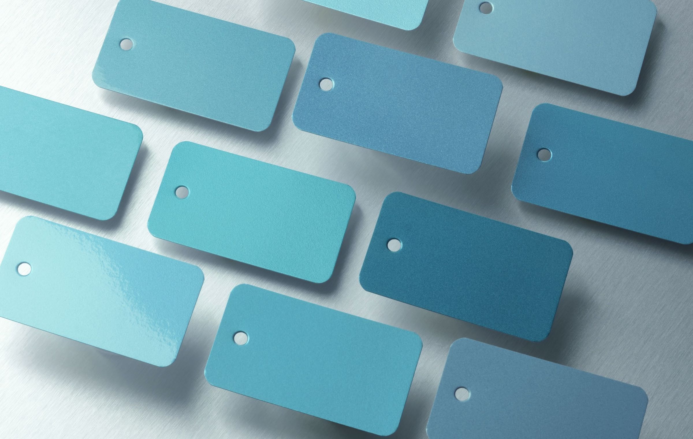 Teal color chips laid out in rows