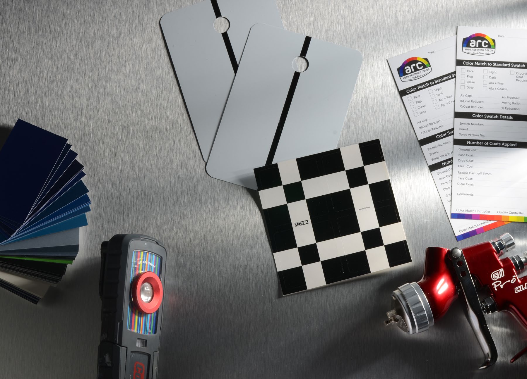 A quality control bench with color chips and measuring equipment
